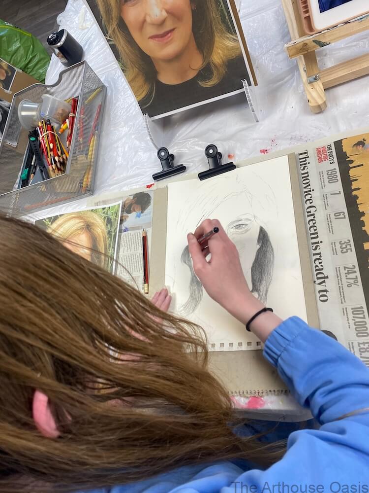 Girl drawing mum's face