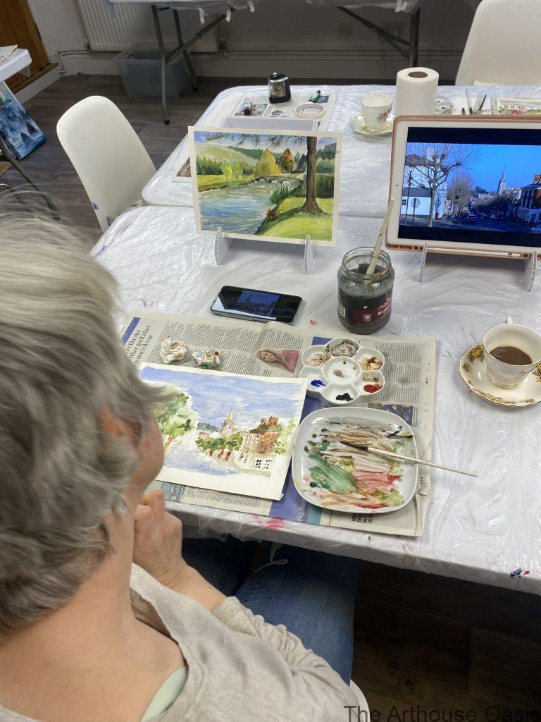 Woman painting Saffron Walden Street Scene