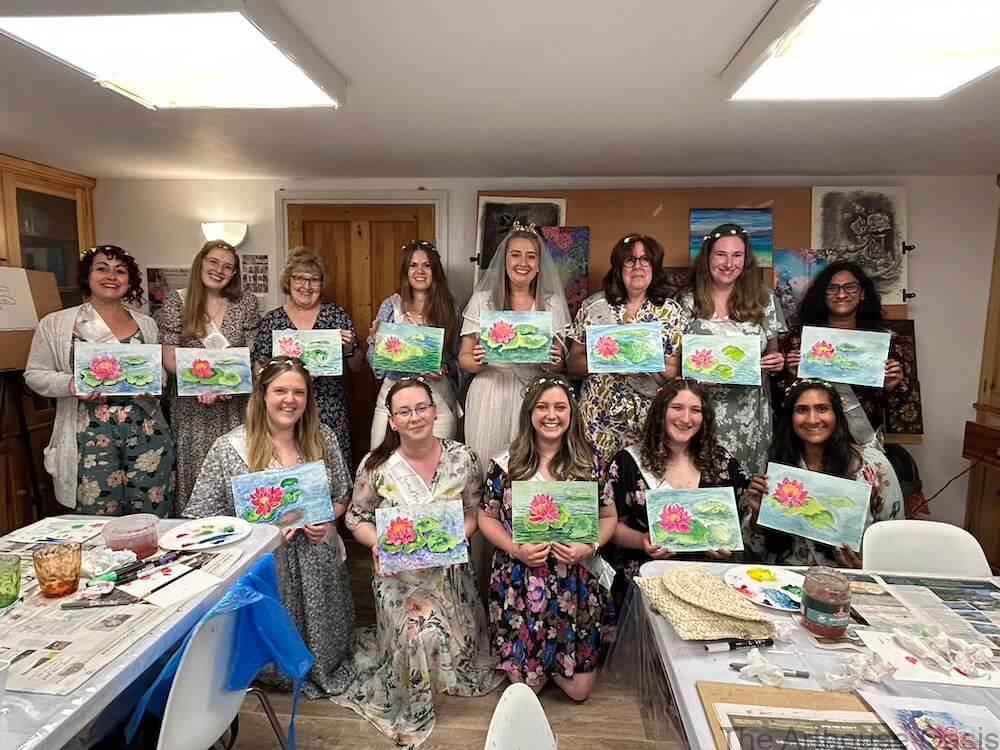 Hen Doo 13 artists showing off their water lily paintings