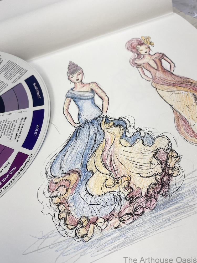 Detailed fashion illustration of flowing dresses using coloured pencils and pen in a student sketchbook.