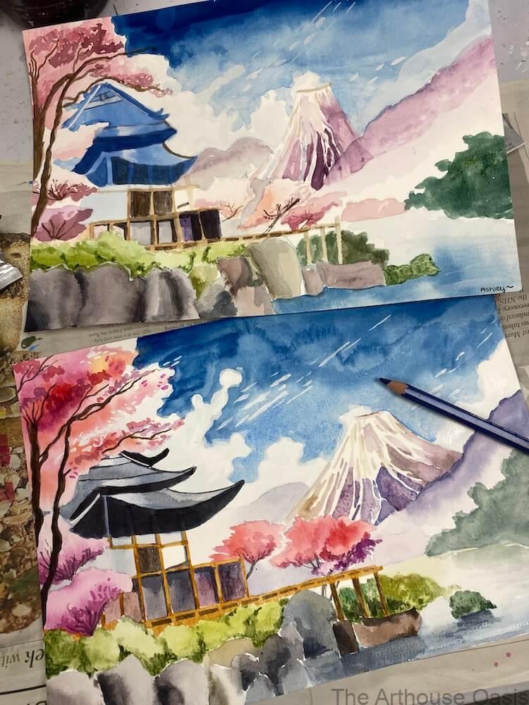 Student watercolour paintings of a Japanese landscape with Mount Fuji and cherry blossom trees.