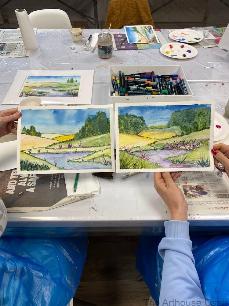 Two watercolour countryside paintings with river and fields in a Bishop’s Stortford art class.
