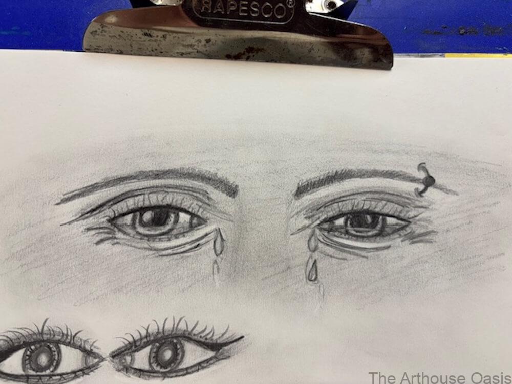 Pencil drawings of expressive eyes with tears